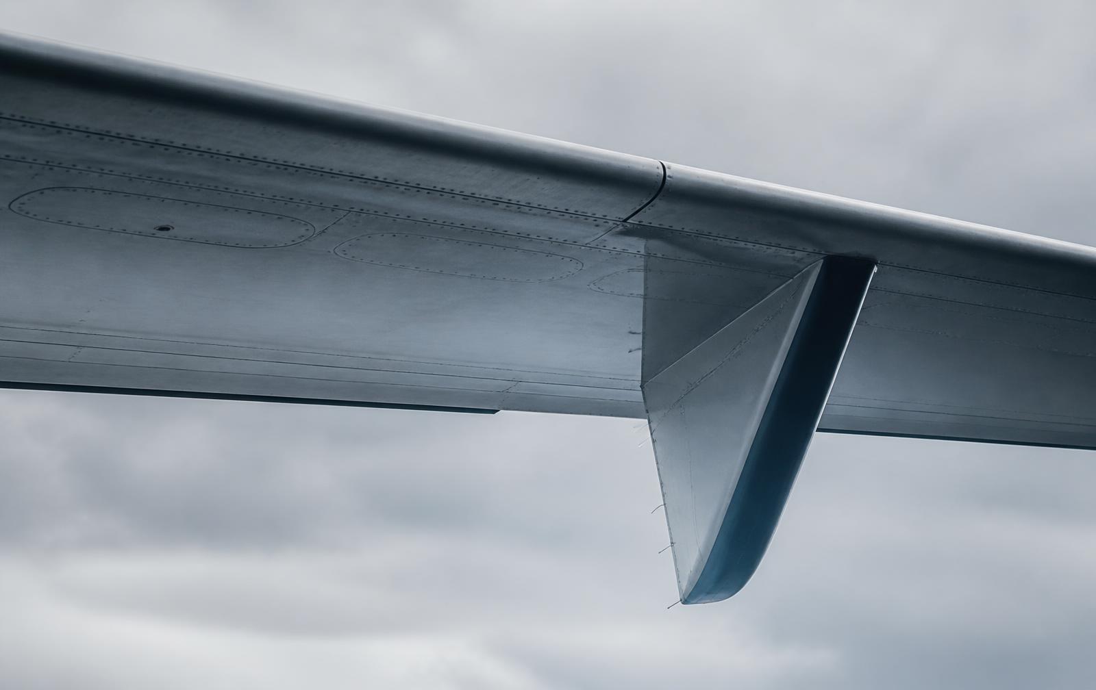 Abstract detail of a commercial aircraft wing and winglet under overcast light